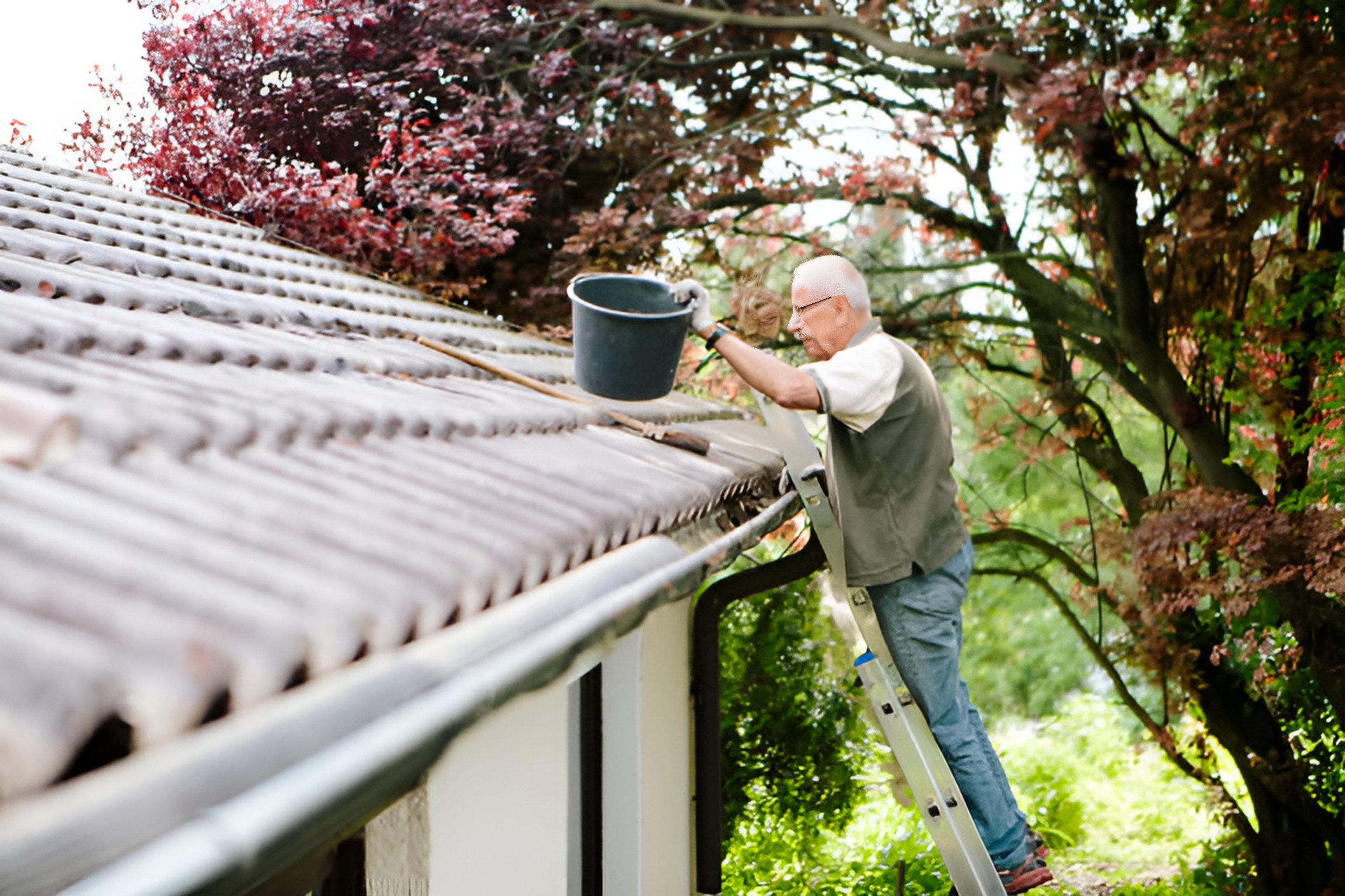 man standing on a ladder, cleaning a metal roof
